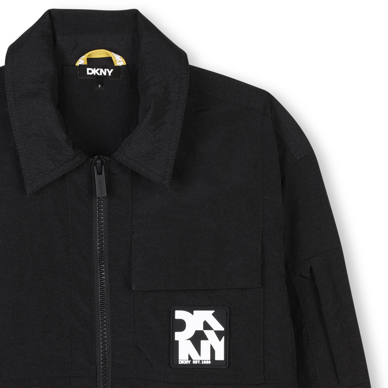 Blouson zipp&eacute; d&eacute;perlant DKNY 
                        UNISEXE